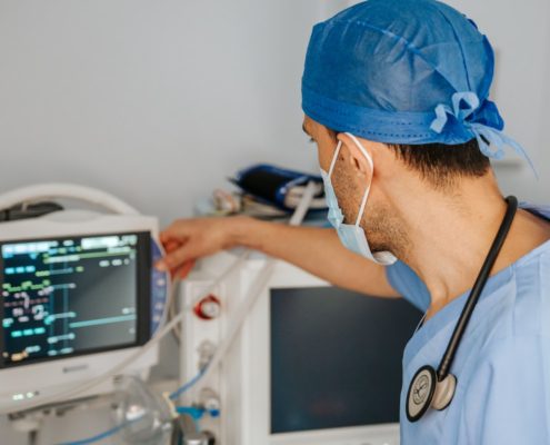 clinician monitoring a patient vital signs monitor during medically supervised detox