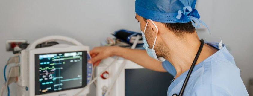 clinician monitoring a patient vital signs monitor during medically supervised detox