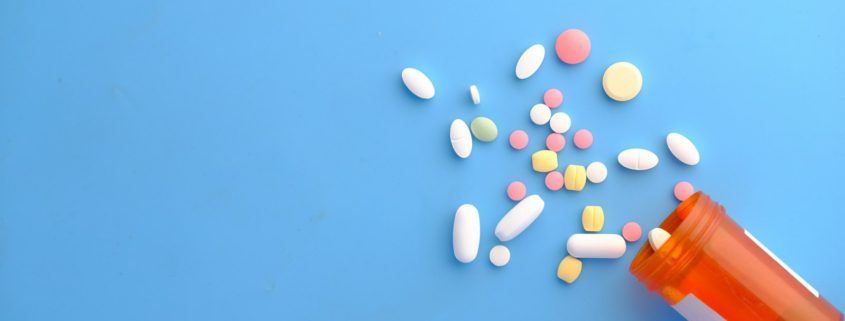 Prescription bottle with pills on a counter — residential rehab for chronic pain and opioid use disorder