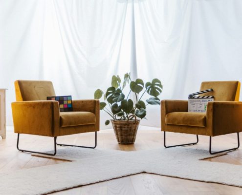 Two chairs in a living-room-style therapy space — EMDR trauma processing in residential addiction treatment