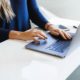 A professional working on a laptop indoors — executive residential rehab remote-work track