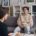 A clinician sitting with a client on a couch during a family-focused therapy session
