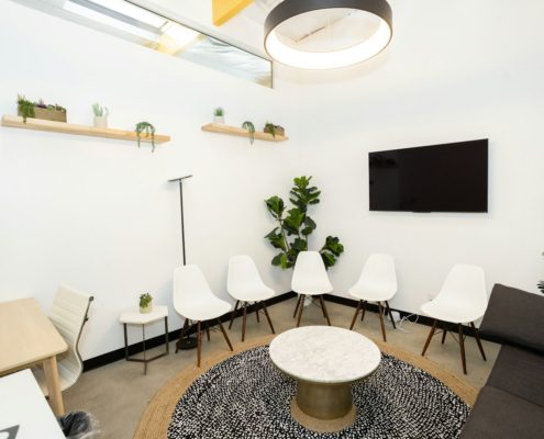 A modern intake waiting room with chairs — first week of residential addiction treatment
