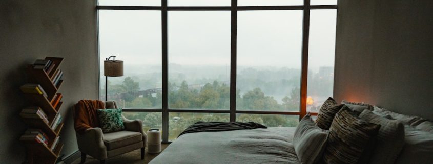 Peaceful bedroom in early morning light, representing the difficulty and importance of sleep in early addiction recovery
