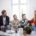 A group of people gathered around a table — supporting a loved one during the first weeks of residential rehab