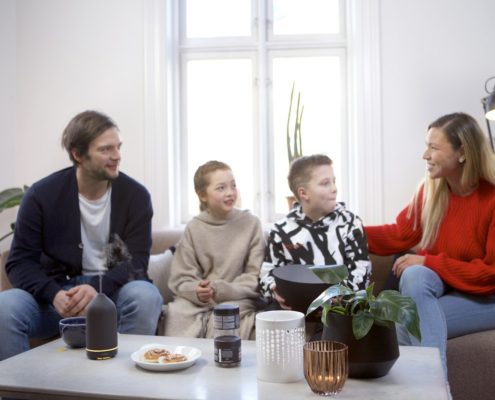A group of people gathered around a table — supporting a loved one during the first weeks of residential rehab