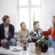 A group of people gathered around a table — supporting a loved one during the first weeks of residential rehab