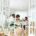 People sitting at a table in a calm indoor conversation — talking to a loved one about rehab