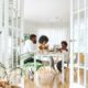 People sitting at a table in a calm indoor conversation — talking to a loved one about rehab