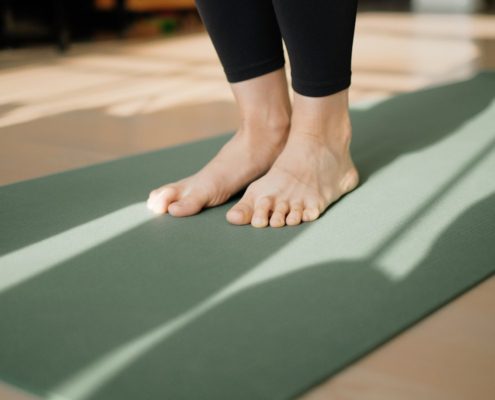 Yoga mat in a natural setting representing the integration of mind-body practices in holistic addiction treatment